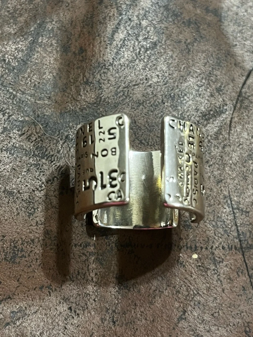 CHANEL Silver Cuff Ring with Embossed Logo